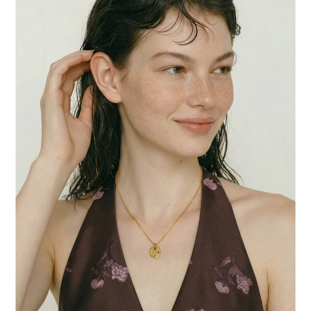 Cubic zirconia multi-color geometric necklace in gold-plated stainless steel with cubic zirconia.
