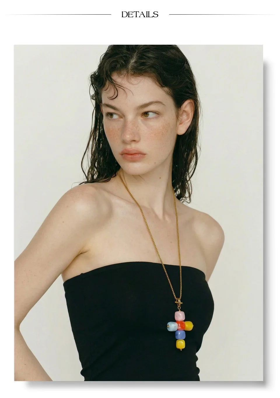 Resin acrylic cross necklace in gold-plated stainless steel with resin and acrylic.