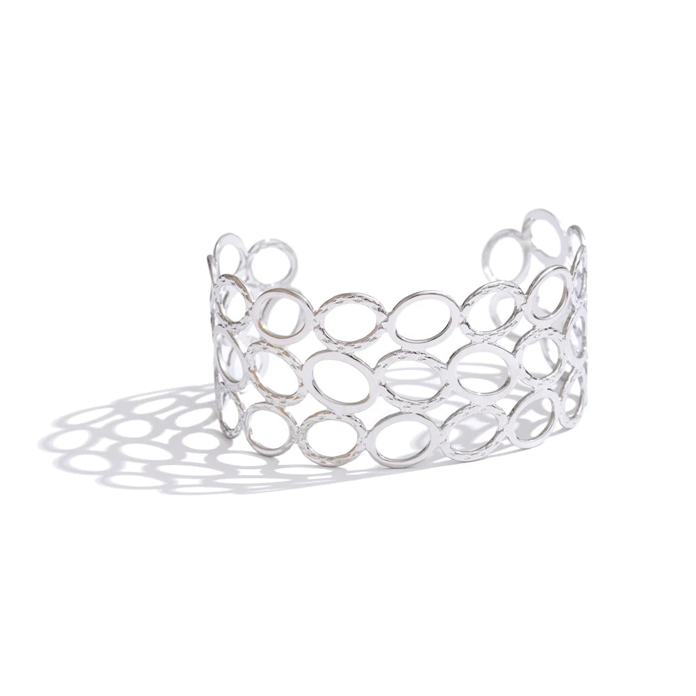 Geometric bracelet in gold-plated stainless steel.