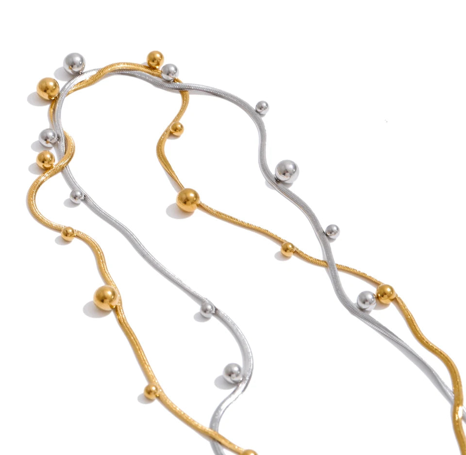 Beaded geometric chain necklace in gold-plated stainless steel.