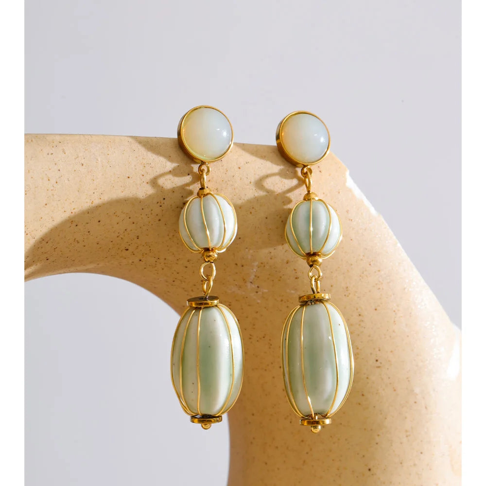 Beaded geometric earrings in gold-plated stainless steel.