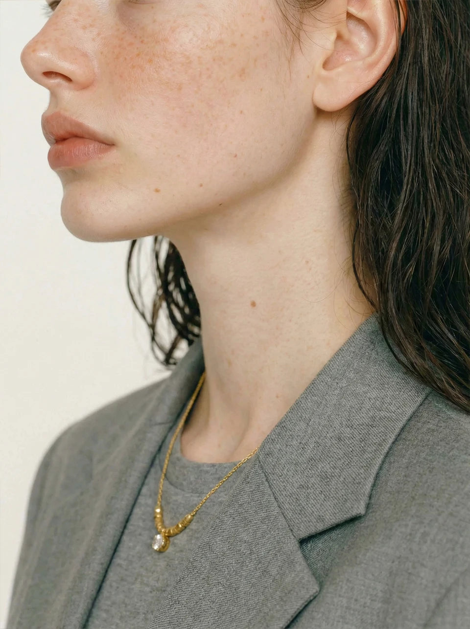 Cubic zirconia beaded geometric necklace in gold-plated stainless steel with cubic zirconia.