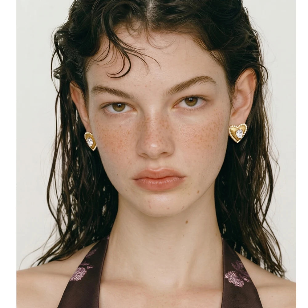 Cubic zirconia heart earrings in gold-plated stainless steel with cubic zirconia.