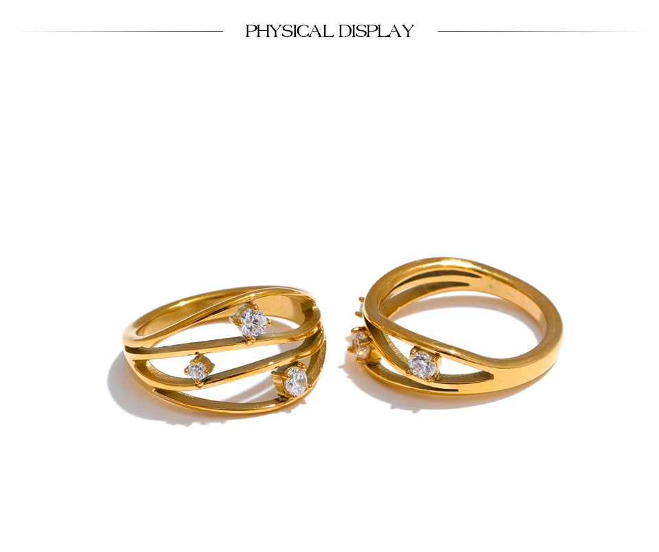 Cubic zirconia geometric ring in 18K gold-plated stainless steel with cubic zirconia.