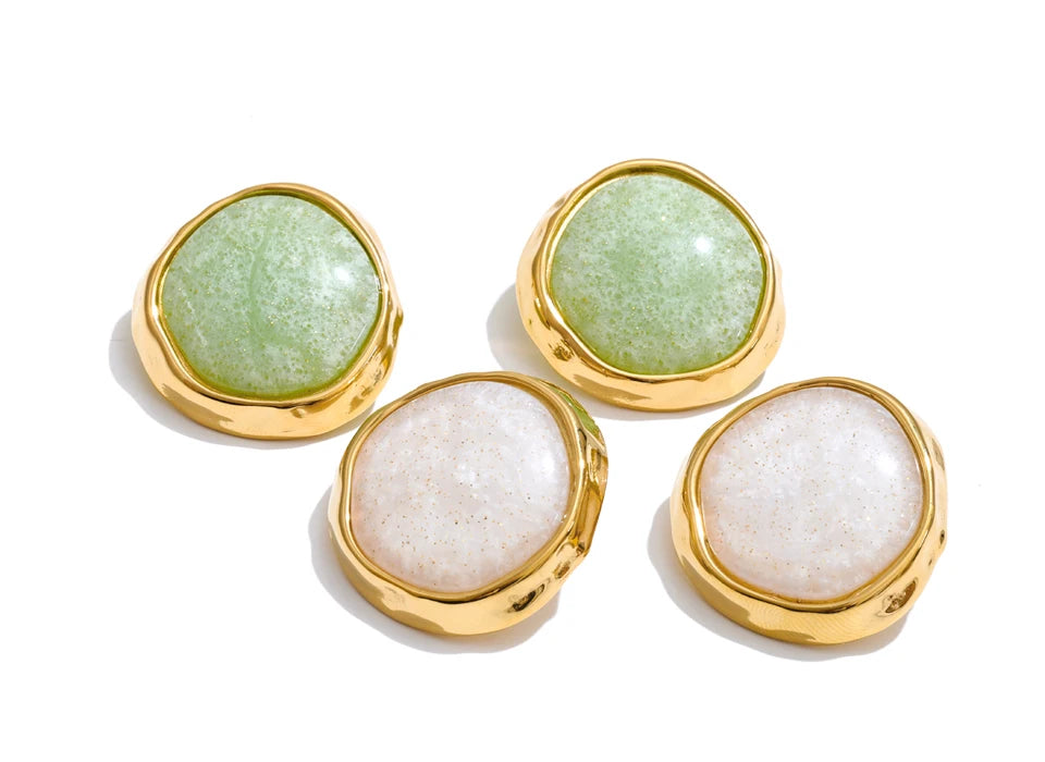 White resin acrylic earrings in gold-plated stainless steel with resin and acrylic.