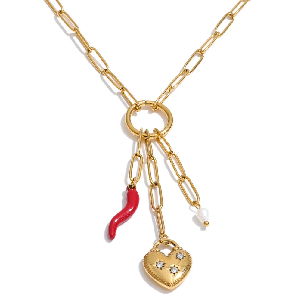 Cubic zirconia freshwater pearl heart necklace in gold-plated stainless steel with freshwater pearl and cubic zirconia.
