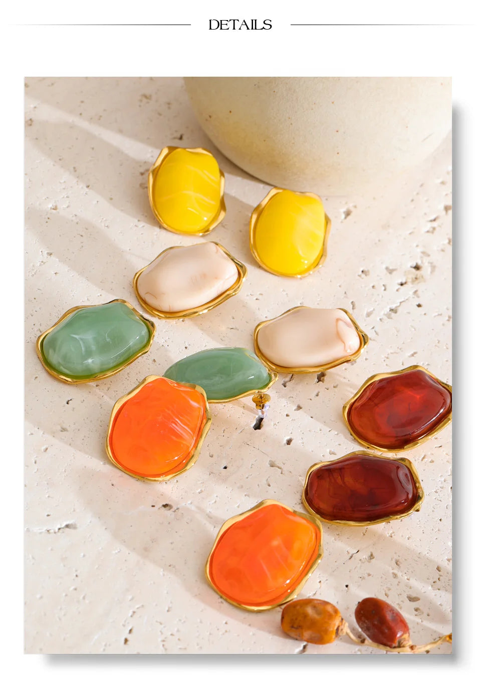 Resin acrylic geometric earrings in gold-plated stainless steel with resin and acrylic.
