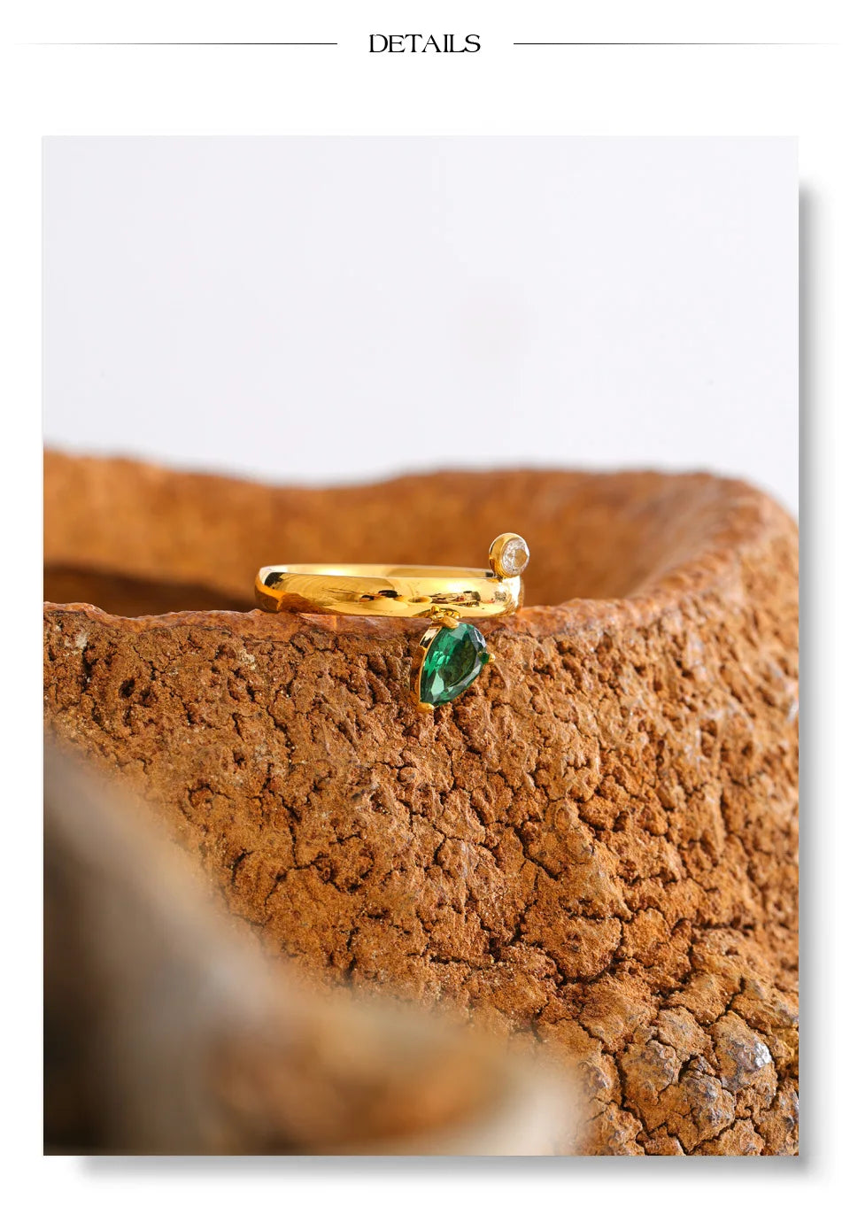 Green cubic zirconia geometric ring in 18K gold-plated stainless steel with cubic zirconia.