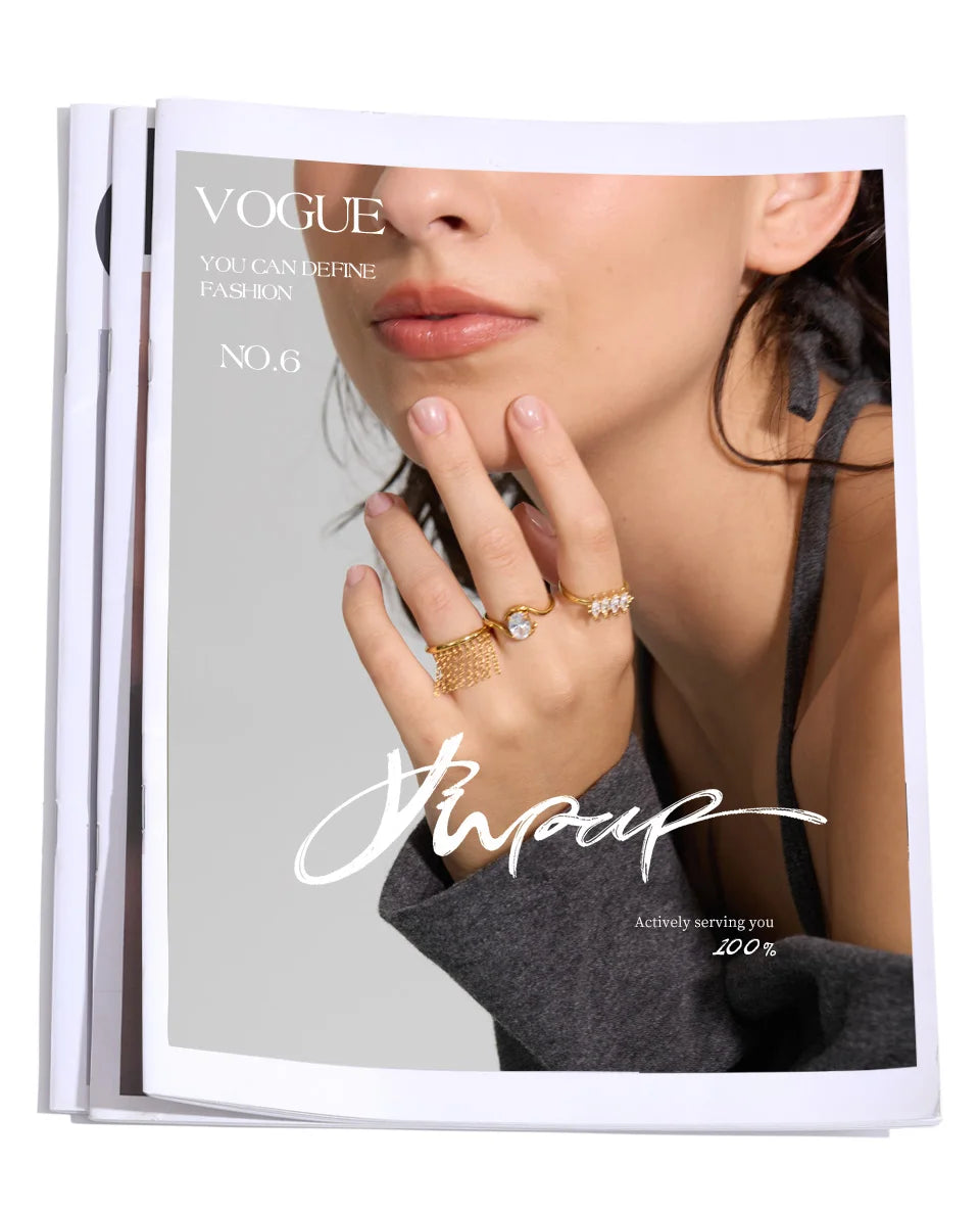 Cubic zirconia geometric ring in 18K gold-plated stainless steel with cubic zirconia.