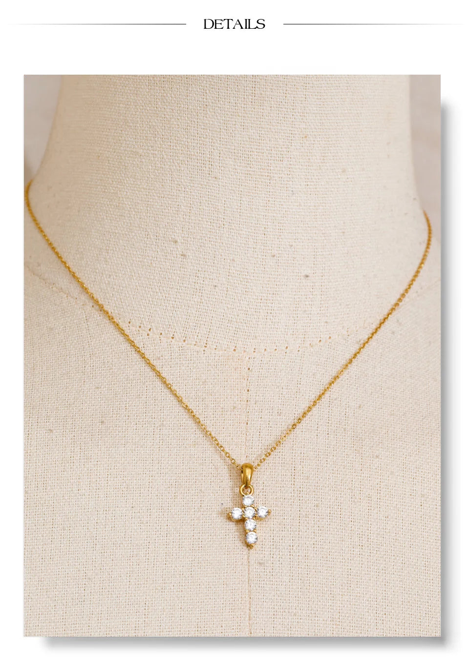 Cubic zirconia cross necklace in gold-plated stainless steel with cubic zirconia.