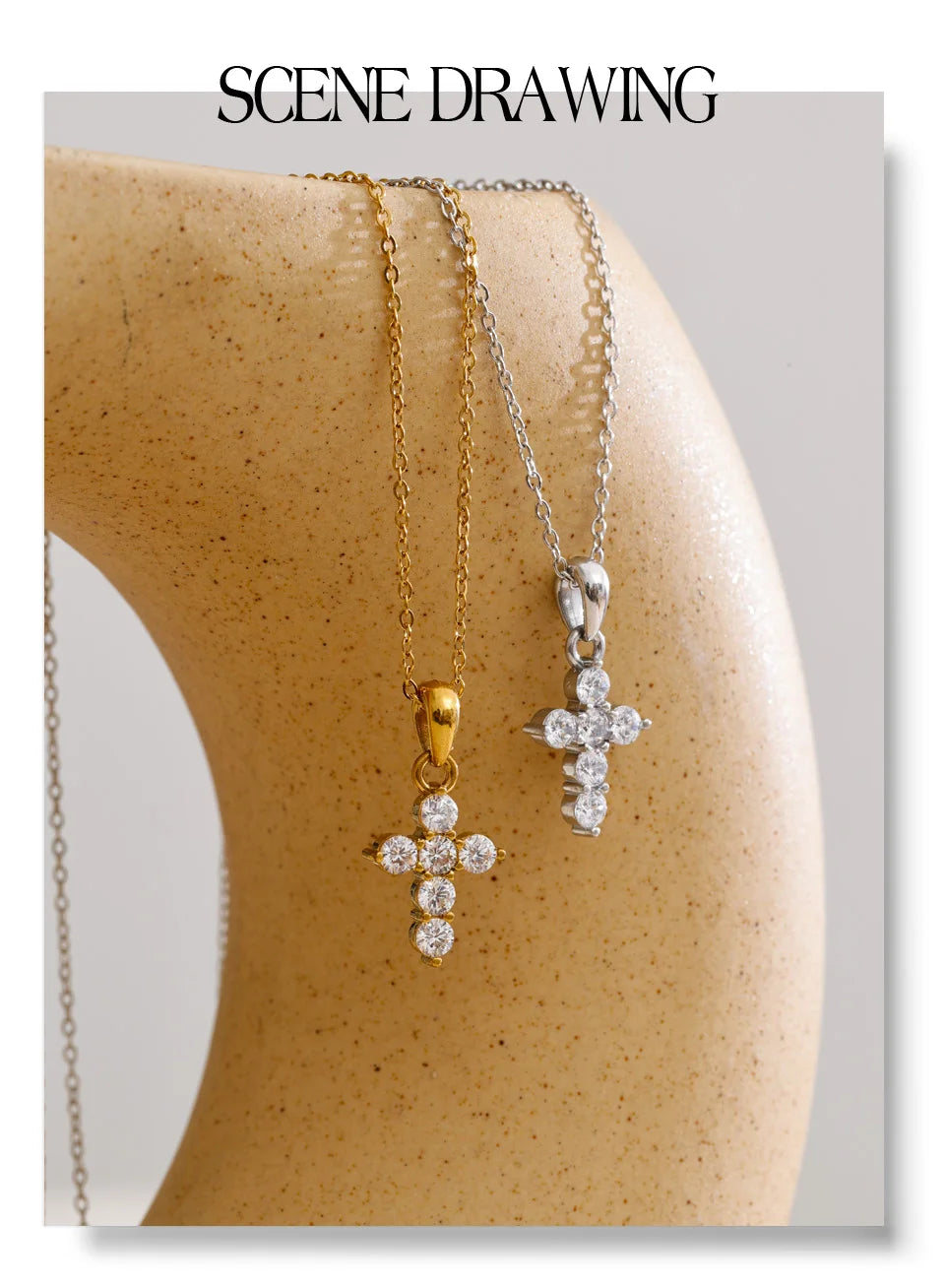 Cubic zirconia cross necklace in gold-plated stainless steel with cubic zirconia.