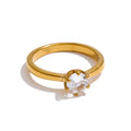 Cubic zirconia geometric ring in 18K gold-plated stainless steel with cubic zirconia.