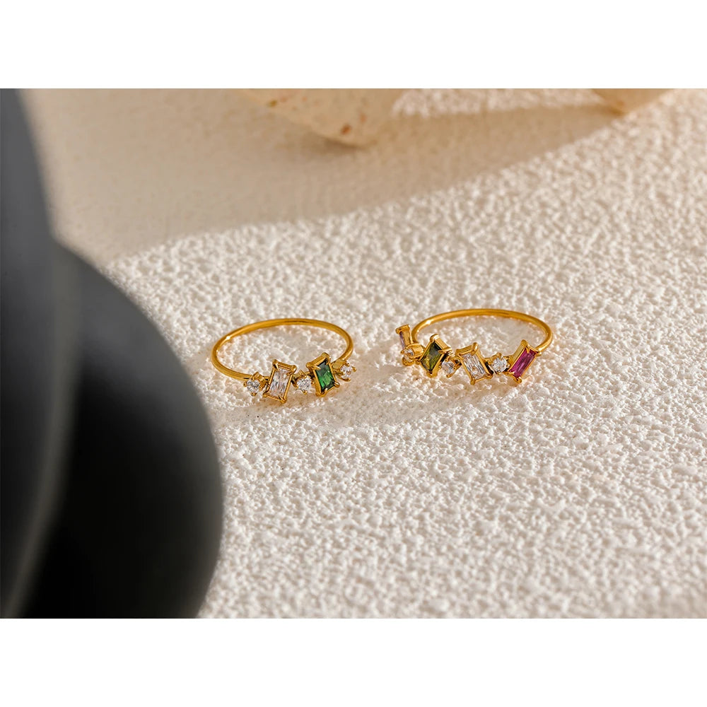 Cubic zirconia multi-color geometric ring in 18K gold-plated stainless steel with cubic zirconia.