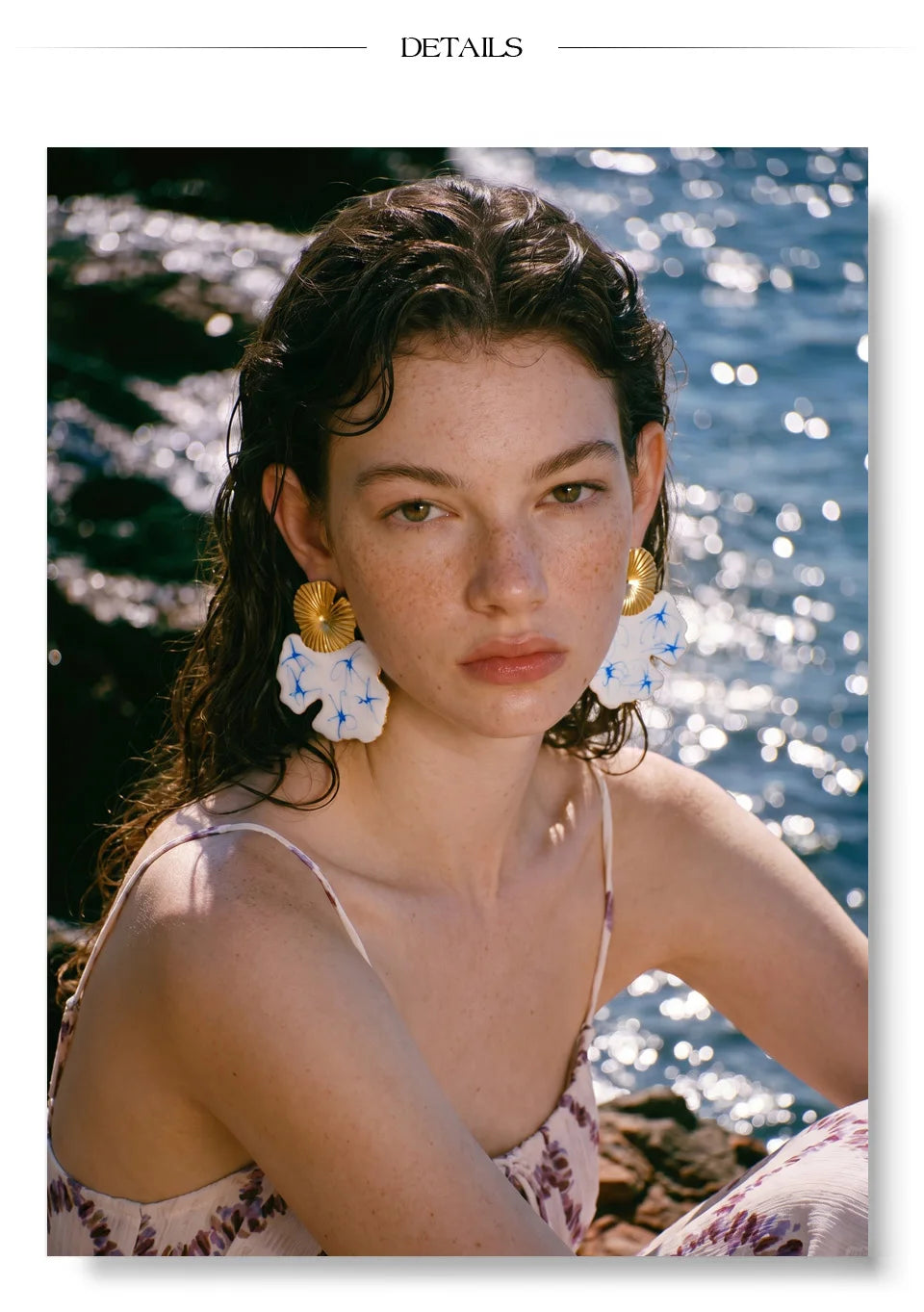 White enamel flower earrings in gold-plated stainless steel with enamel.