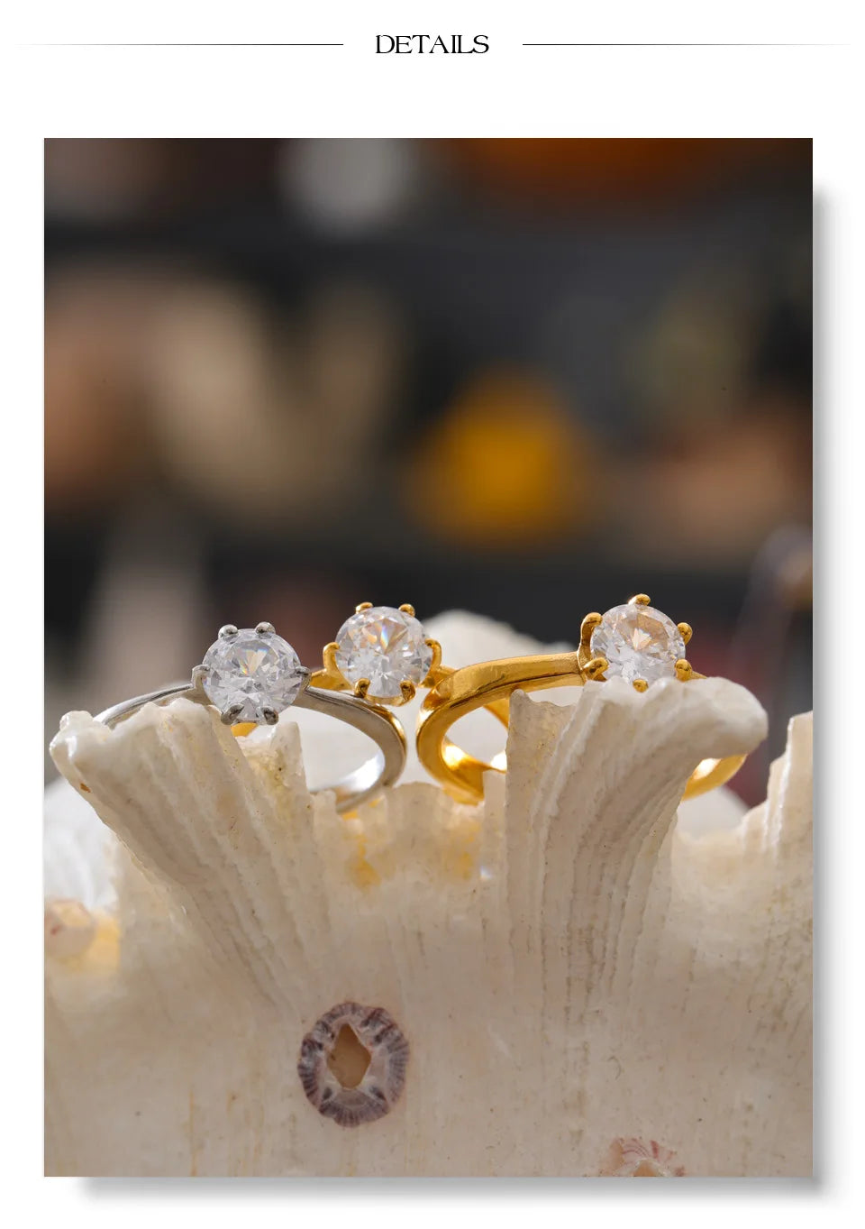 Cubic zirconia geometric ring in 18K gold-plated stainless steel with cubic zirconia.