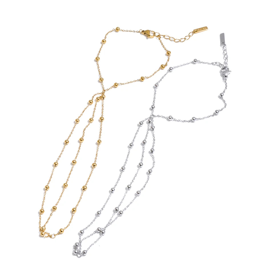 Beaded geometric chain necklace in gold-plated stainless steel.