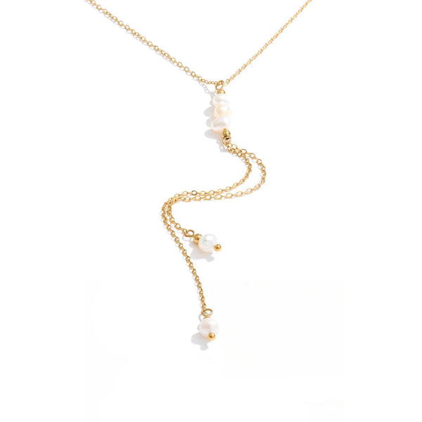 Gold-plated stainless steel necklace with freshwater pearl pendant featuring a delicate white flower design.