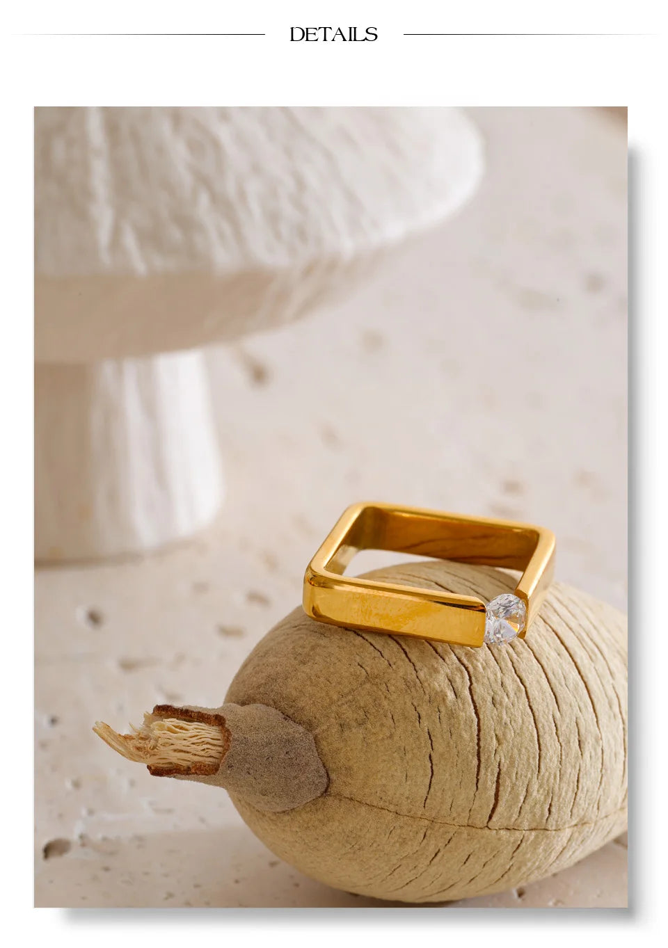 Cubic zirconia minimalist geometric ring in 18K gold-plated stainless steel with cubic zirconia.