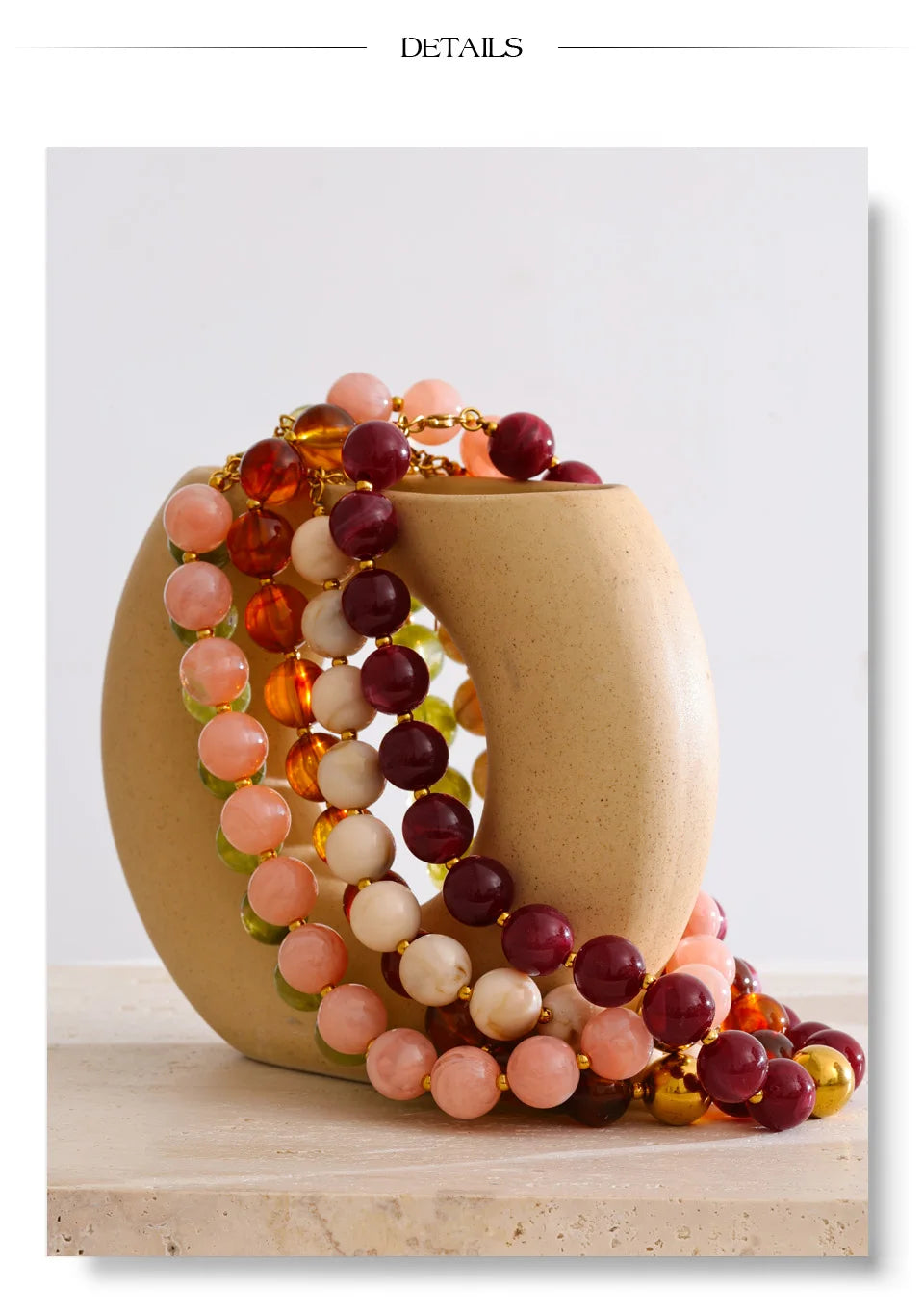 Resin beaded multi-color necklace in gold-plated stainless steel with resin.