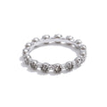 Cubic zirconia flower geometric ring in 18K gold-plated stainless steel with cubic zirconia.