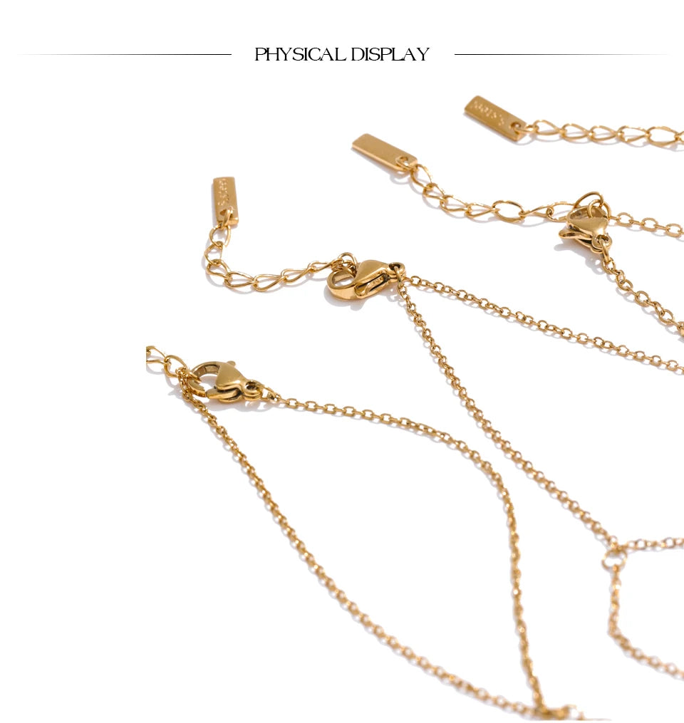 Cubic zirconia geometric chain necklace in gold-plated stainless steel with cubic zirconia.