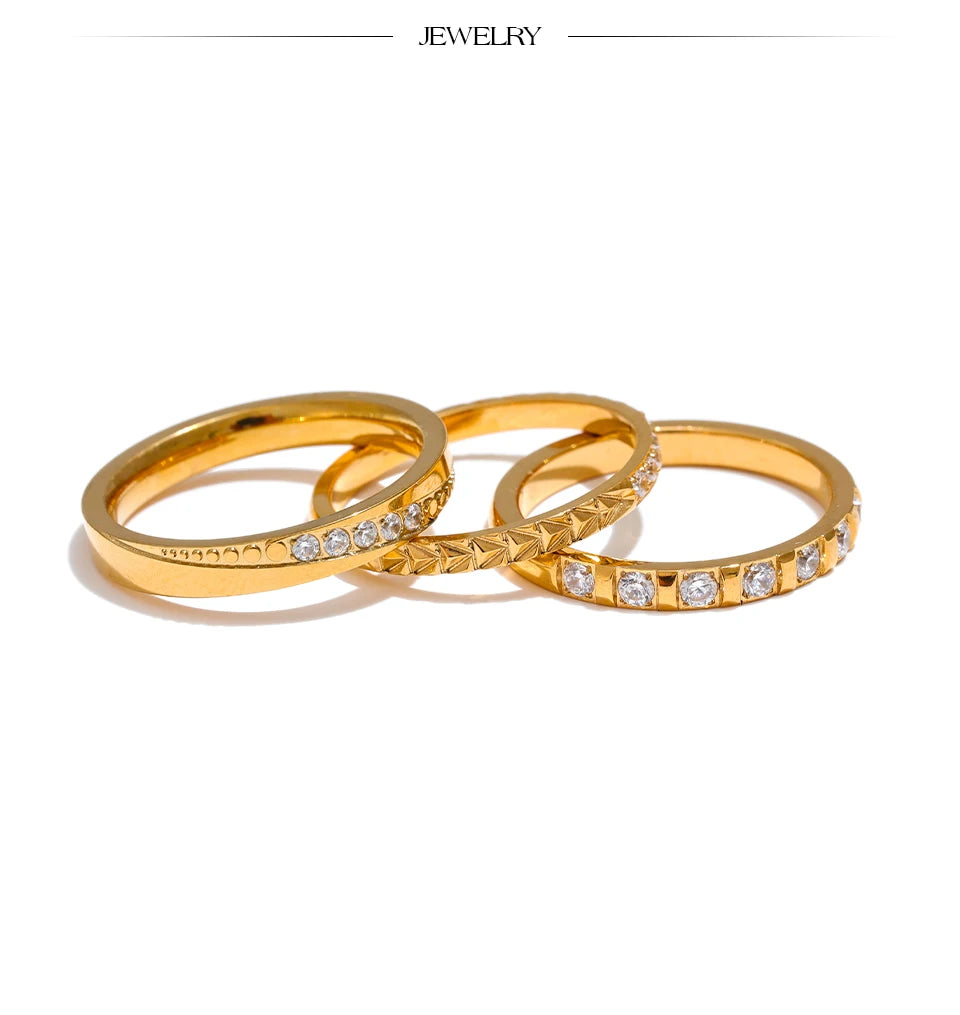 Cubic zirconia geometric ring in 18K gold-plated stainless steel with cubic zirconia.