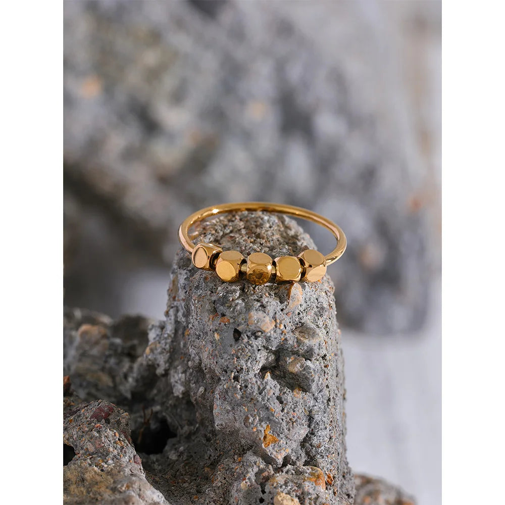 Beaded geometric ring in 18K gold-plated stainless steel.