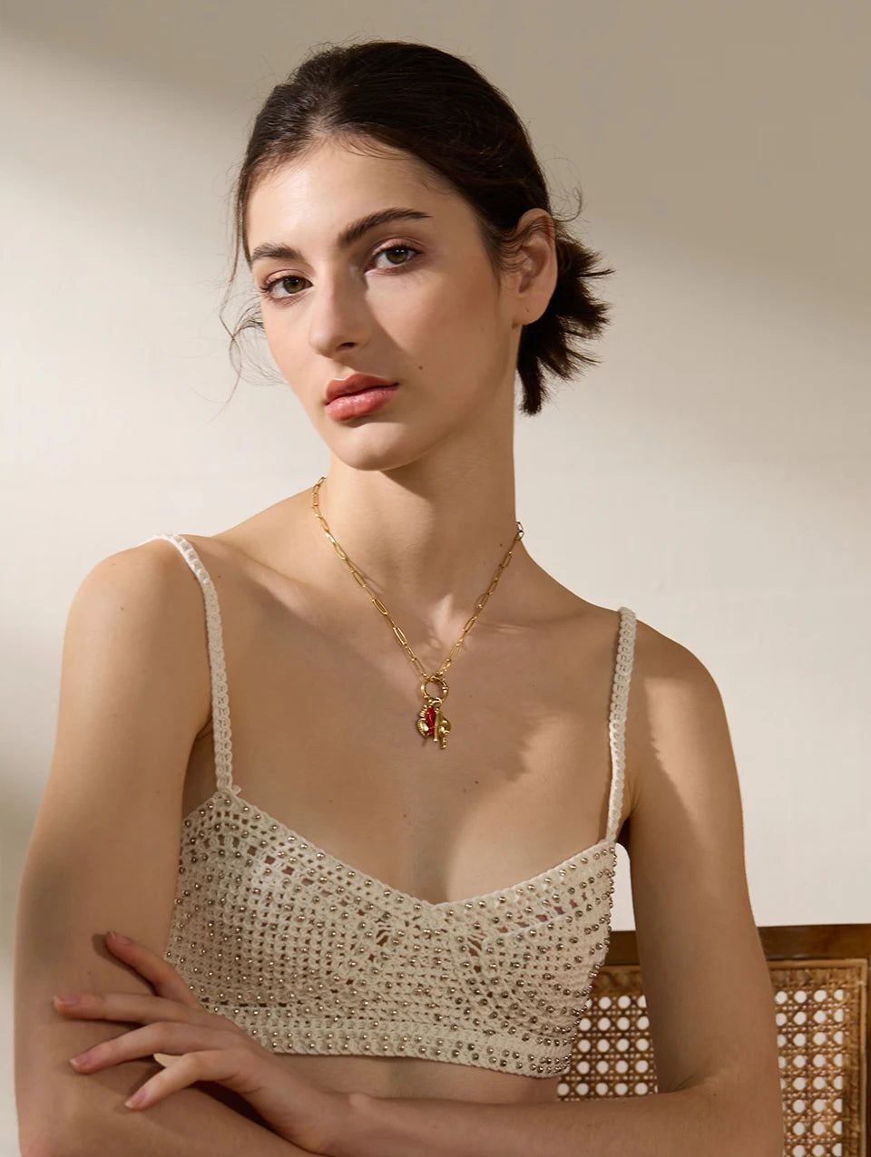 Red heart geometric necklace in gold-plated 316L stainless steel.