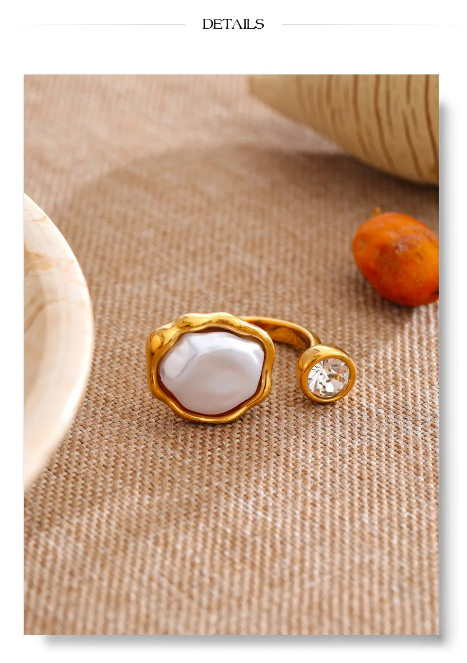 Cubic zirconia pearl geometric ring in 18K gold-plated stainless steel with pearl and cubic zirconia.