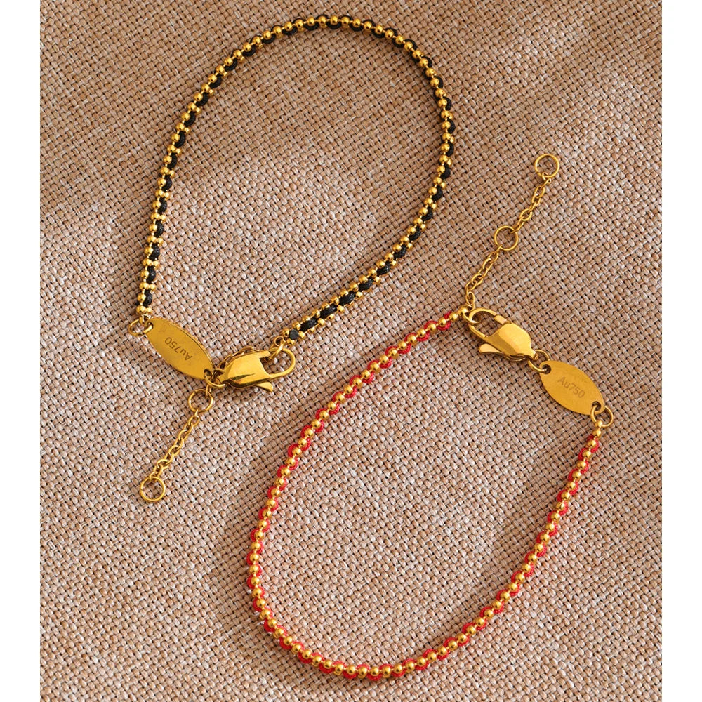 Black geometric chain necklace in gold-plated stainless steel.