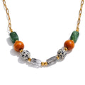 Resin natural stone beaded necklace in gold-plated stainless steel with natural stone and resin.