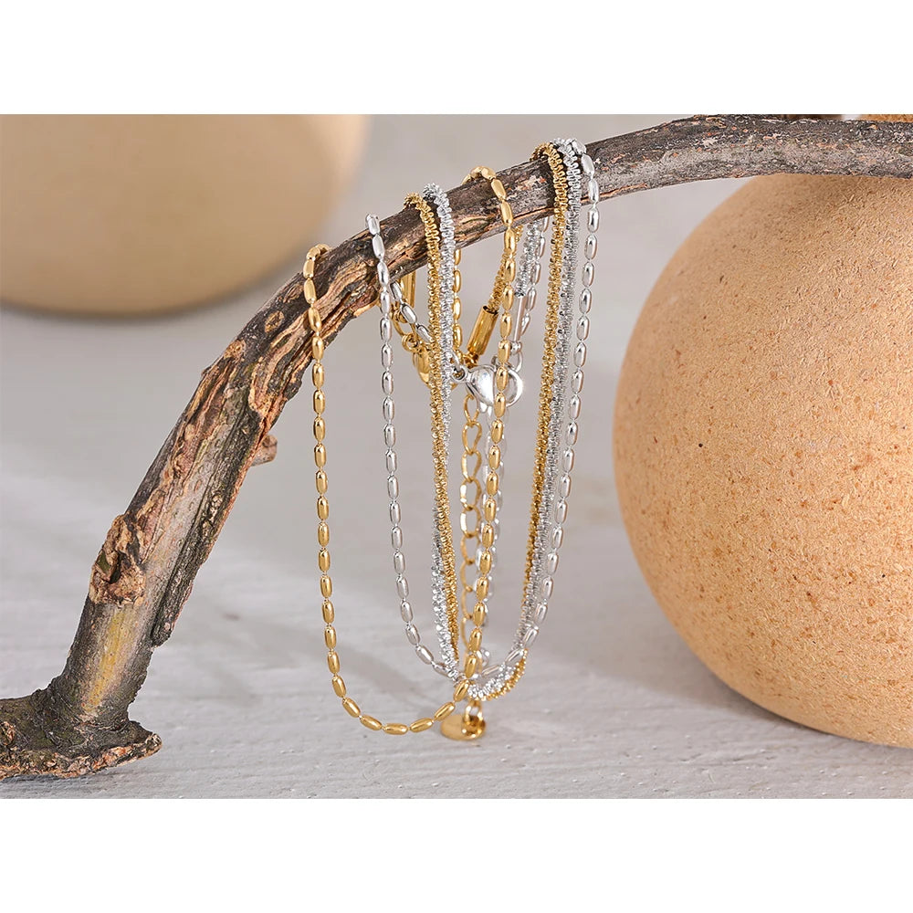 Geometric chain layered necklace in gold-plated stainless steel.
