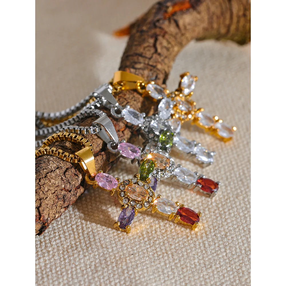 Cubic zirconia cross multi-color necklace in gold-plated stainless steel with cubic zirconia.