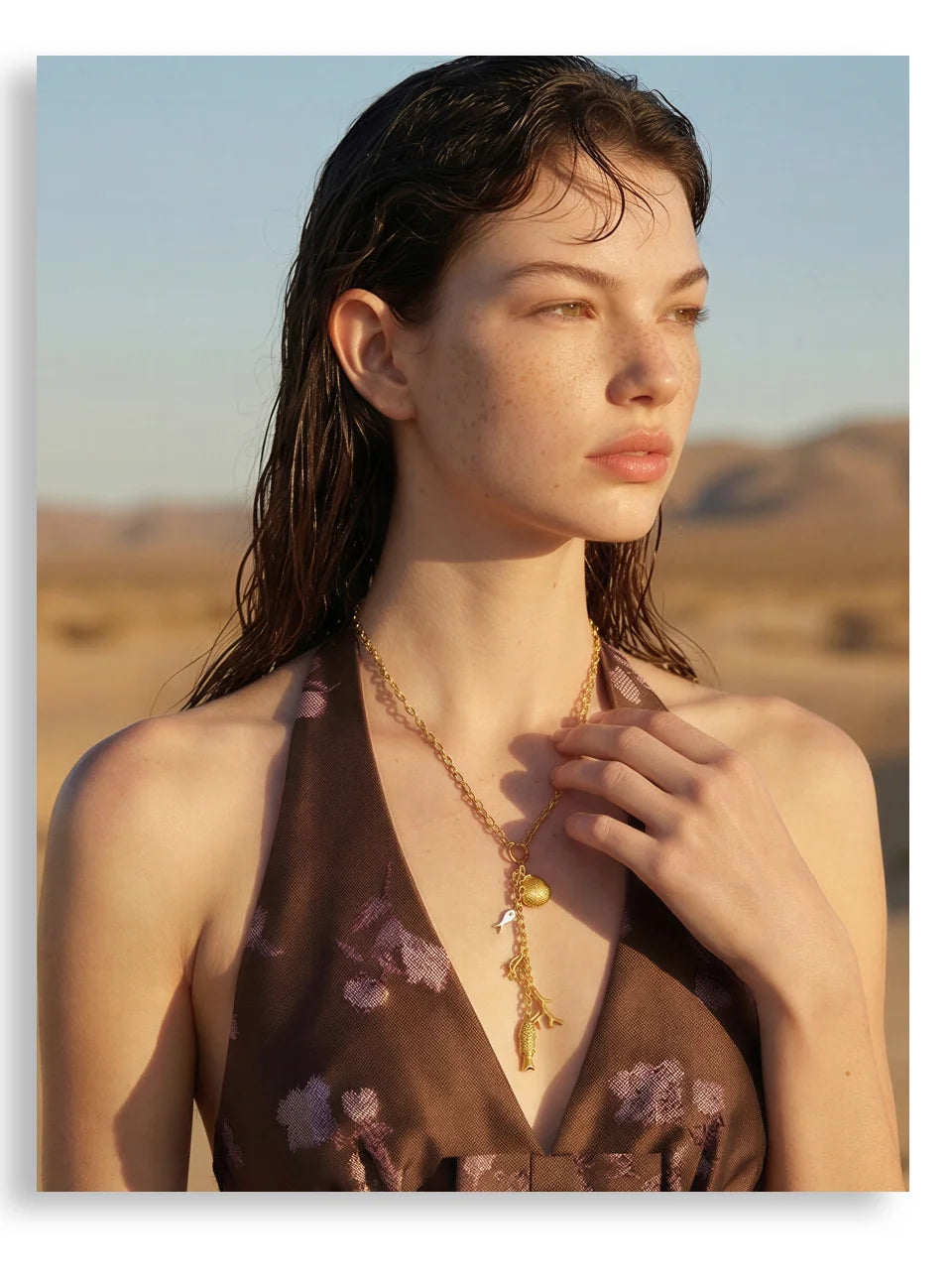 Cubic zirconia shell geometric necklace in gold-plated stainless steel with cubic zirconia and shell.