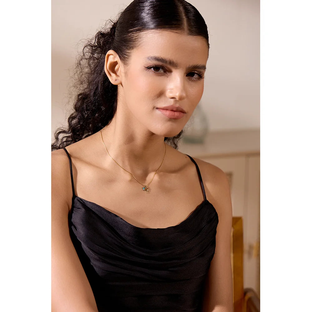 Cubic zirconia star necklace in gold-plated stainless steel with cubic zirconia.