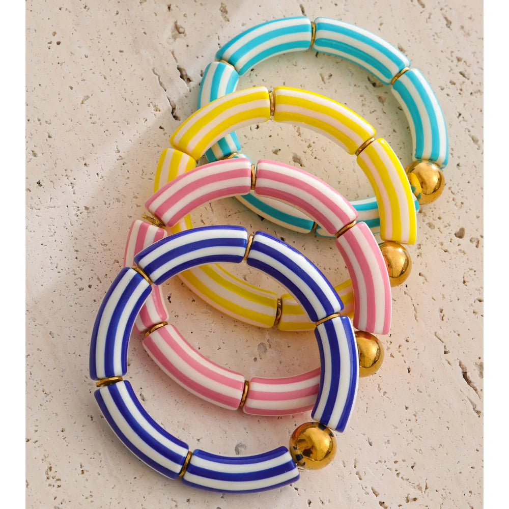 Resin acrylic multi-color bracelet in gold-plated stainless steel with resin and acrylic.