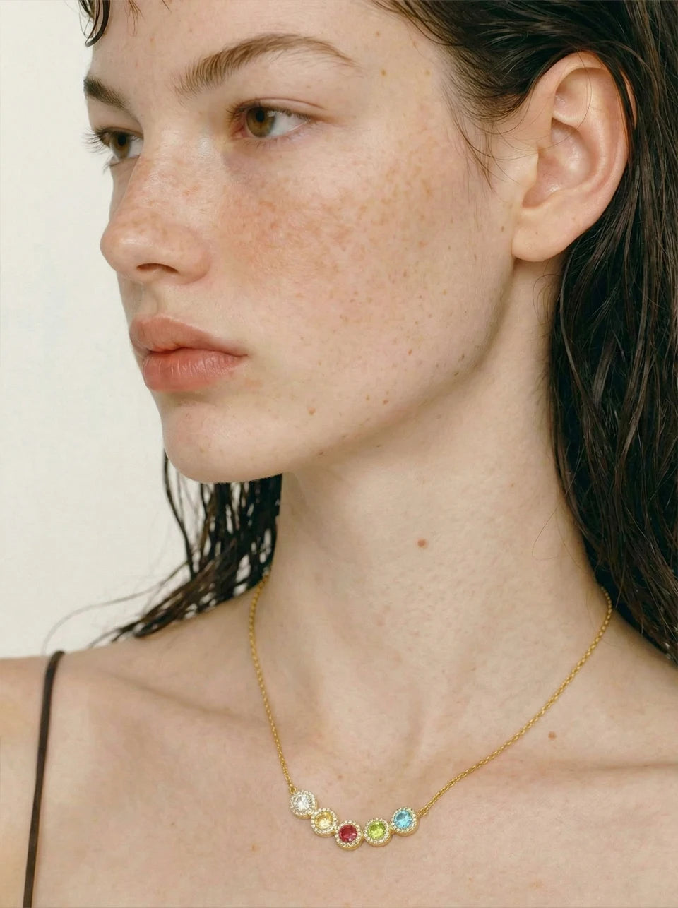 Cubic zirconia multi-color geometric necklace in gold-plated stainless steel with cubic zirconia.