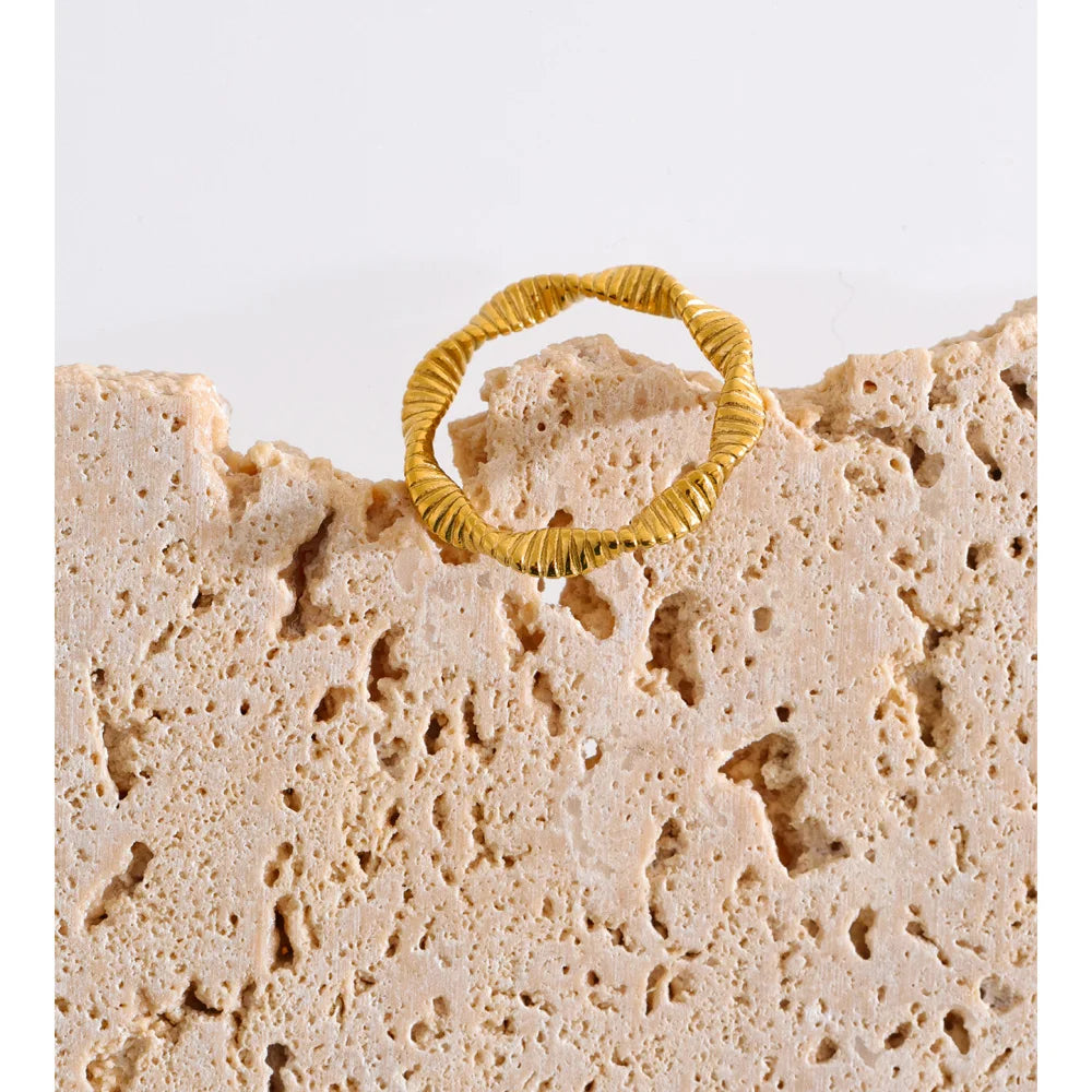 Geometric ring in 18K gold-plated stainless steel.