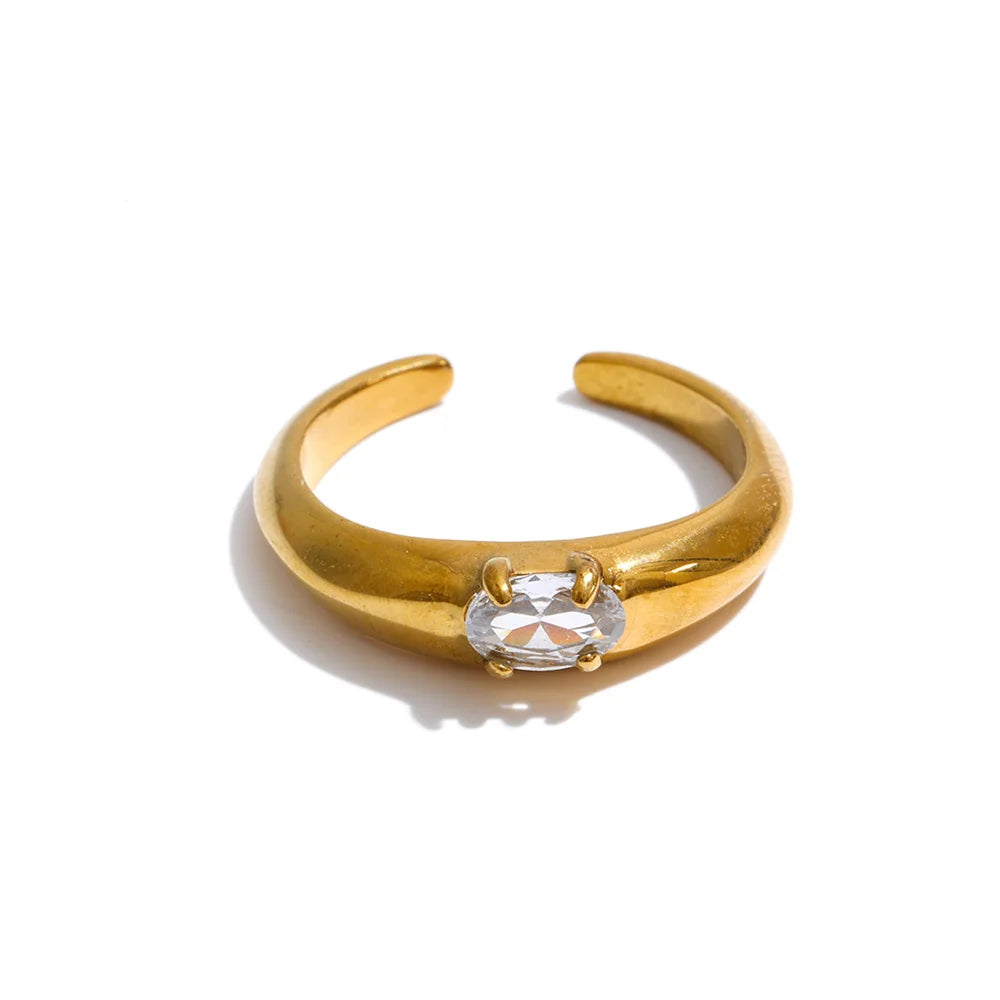 Cubic zirconia geometric ring in 18K gold-plated stainless steel with cubic zirconia.