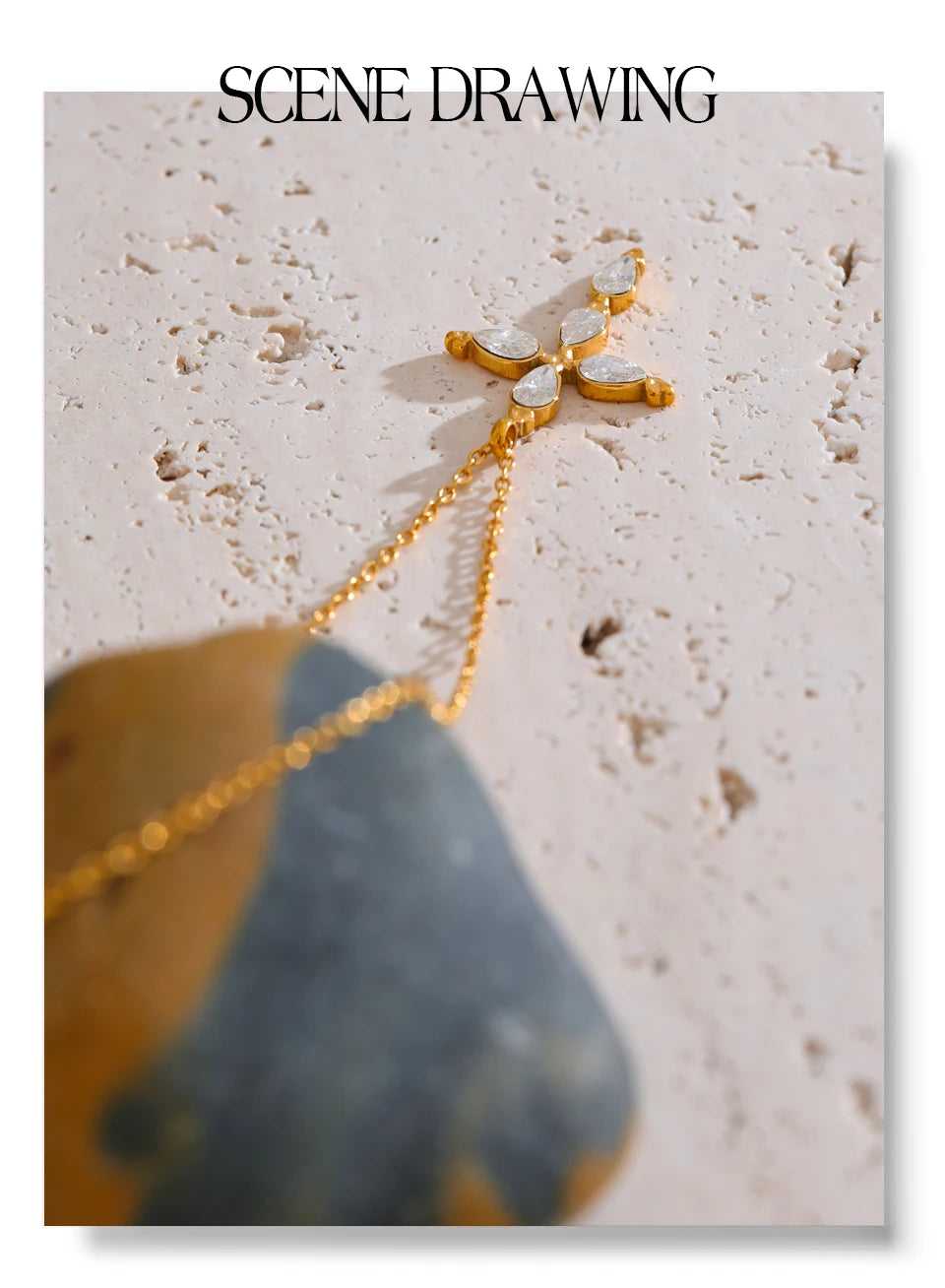 Cubic zirconia cross necklace in gold-plated stainless steel with cubic zirconia.