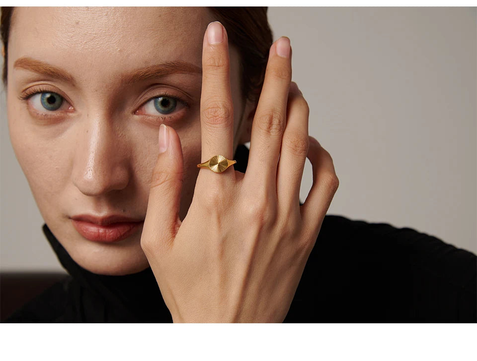 Geometric ring in gold-plated stainless steel.