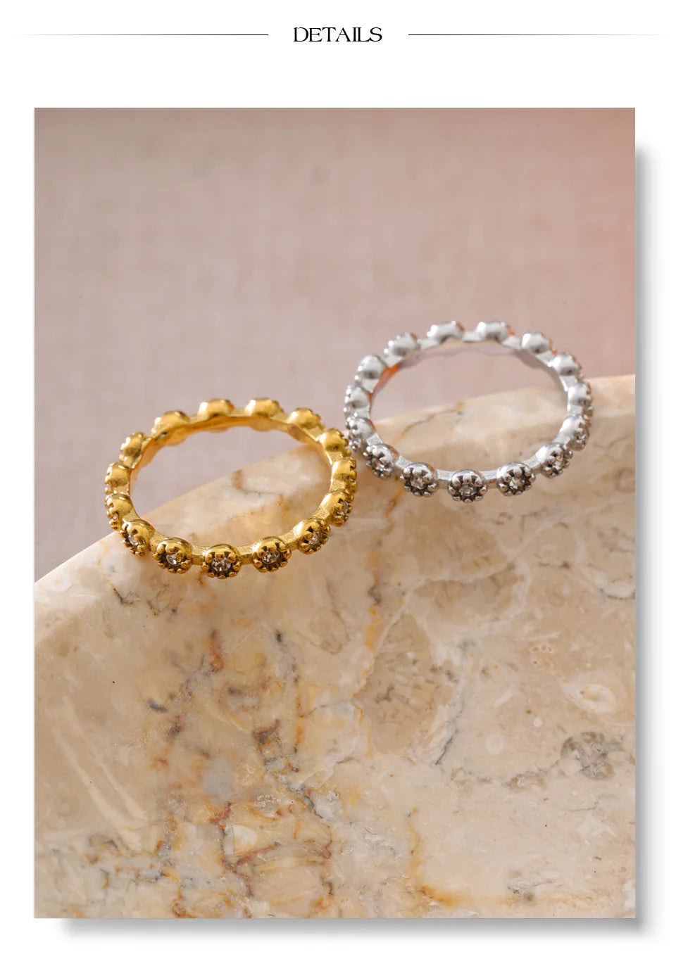 Cubic zirconia flower geometric ring in 18K gold-plated stainless steel with cubic zirconia.