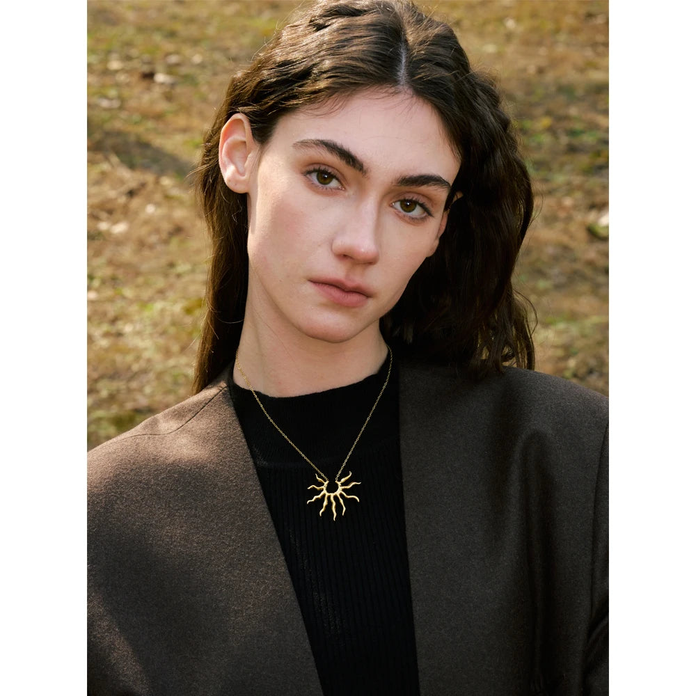 Sun geometric necklace in gold-plated stainless steel.