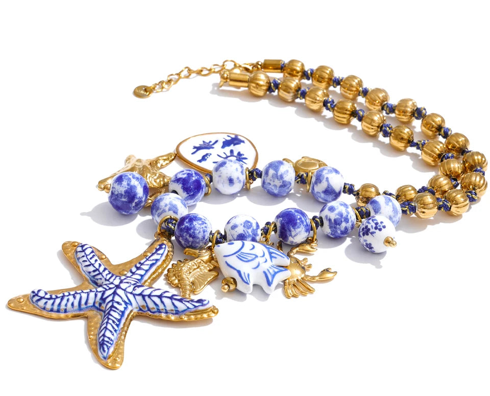 Star beaded geometric necklace in gold-plated stainless steel.