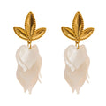White resin acrylic earrings in gold-plated stainless steel with resin and acrylic.