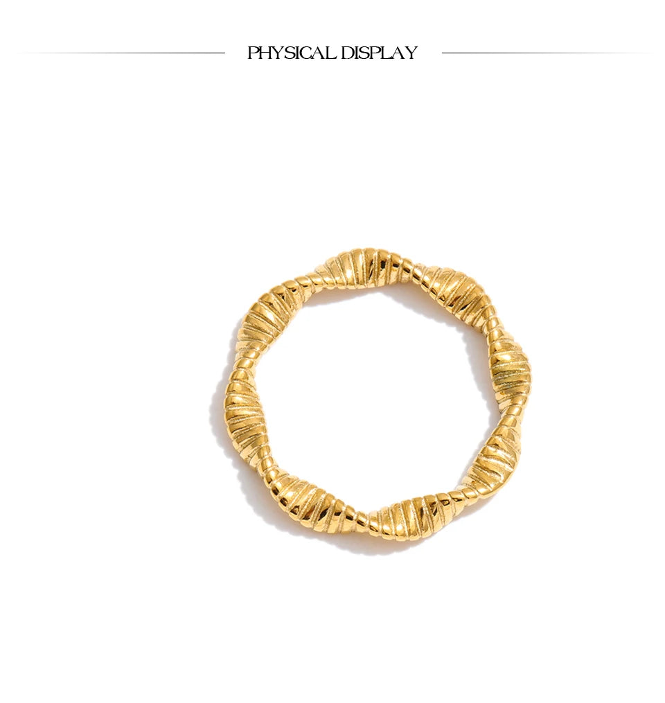 Geometric ring in 18K gold-plated stainless steel.