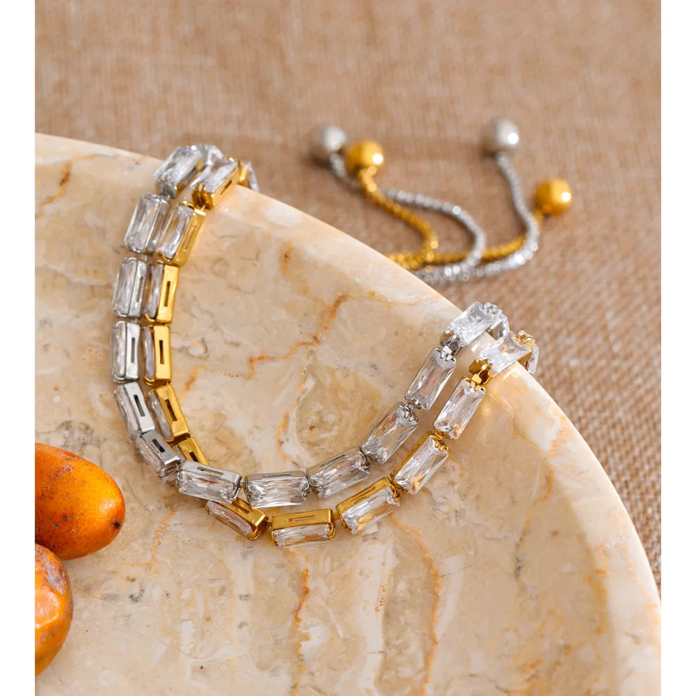 Cubic zirconia geometric bracelet in gold-plated stainless steel with cubic zirconia.
