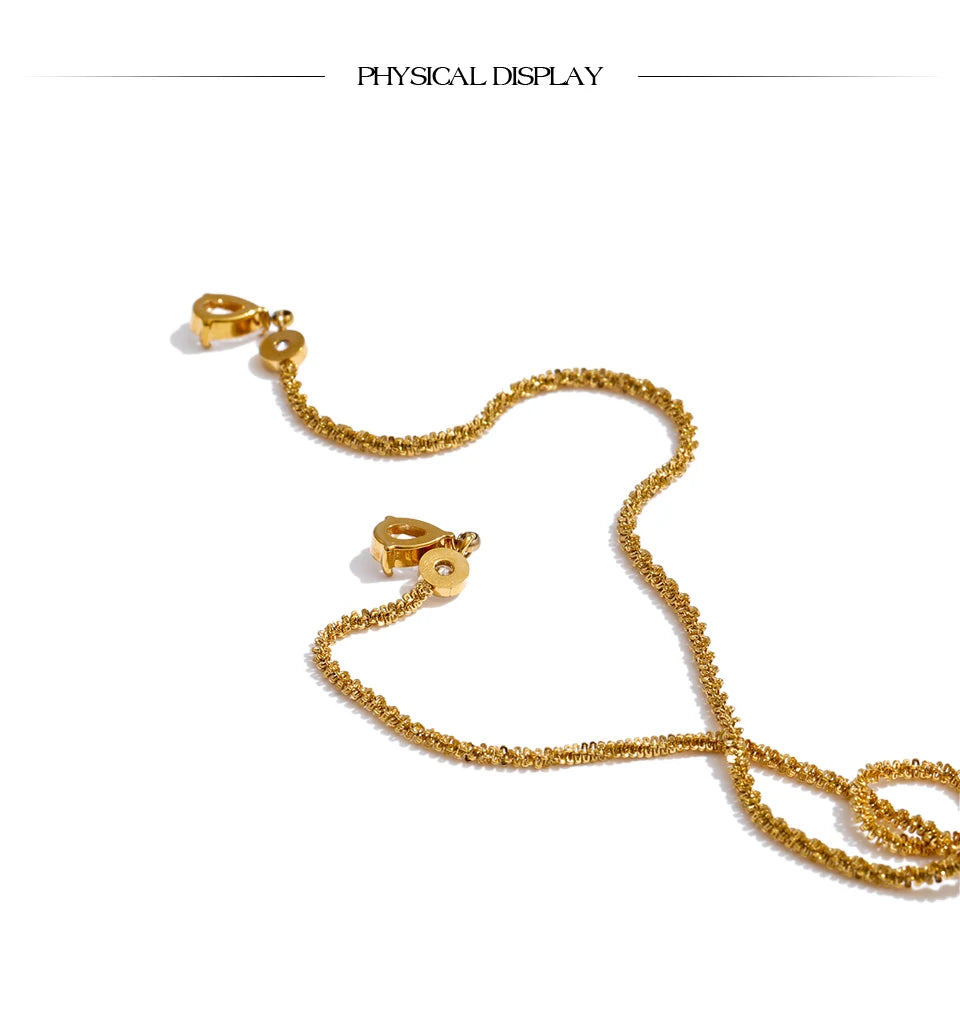 Cubic zirconia geometric chain necklace in gold-plated stainless steel with cubic zirconia.
