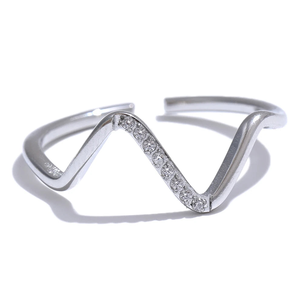 Cubic zirconia geometric ring in 18K gold-plated stainless steel with cubic zirconia.