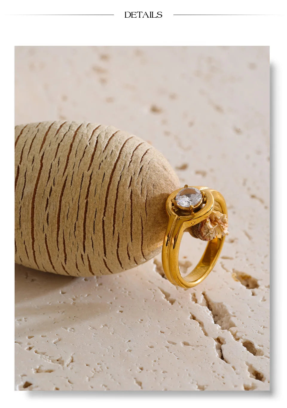 Cubic zirconia geometric ring in 18K gold-plated stainless steel with cubic zirconia.